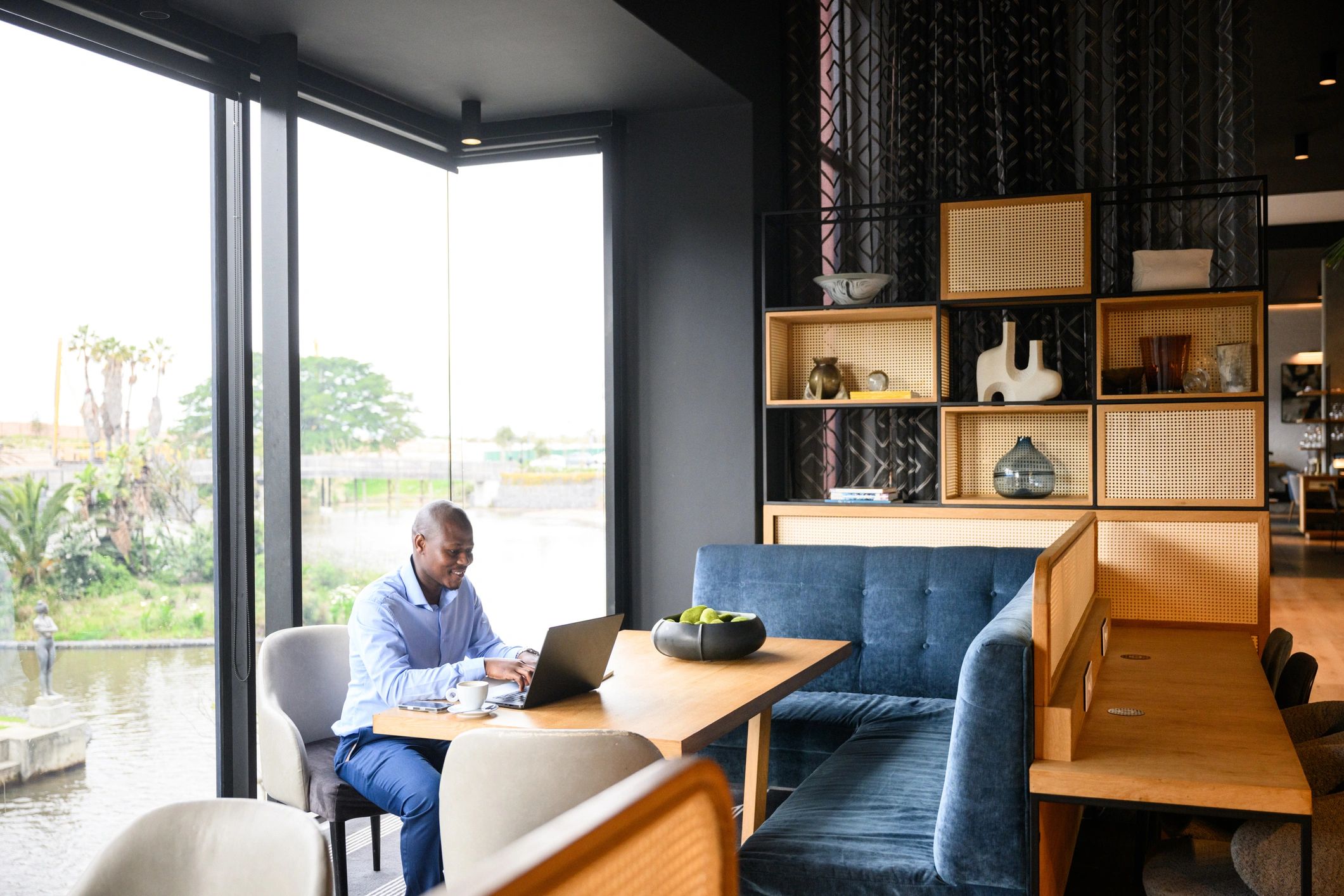 Professional insurance operations manager working on a laptop in a modern office
